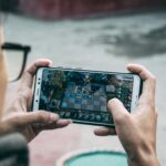 Man playing a game on his phone