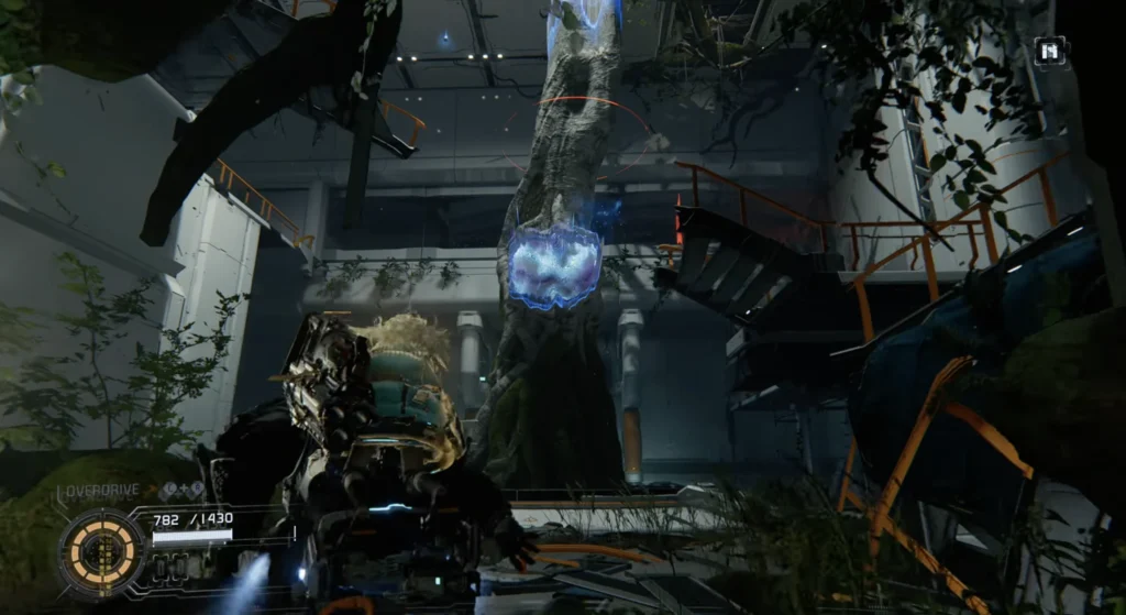 Pragmata third-person gameplay showing Hugh and Diana exploring an overgrown indoor environment on The Cradle, with a glowing blue object on a tree trunk and the Overdrive HUD visible